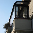 Veranda in alluminio ossidato nero, tetto curvo in policarbonato a doppia parete [1]