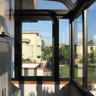 Veranda in alluminio ossidato nero, tetto curvo in policarbonato a doppia parete [3]